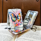 Butterfly-themed phone case with mirror on an open book