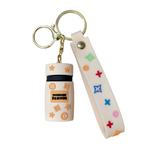 Keychain with a small container and colorful design on a white background