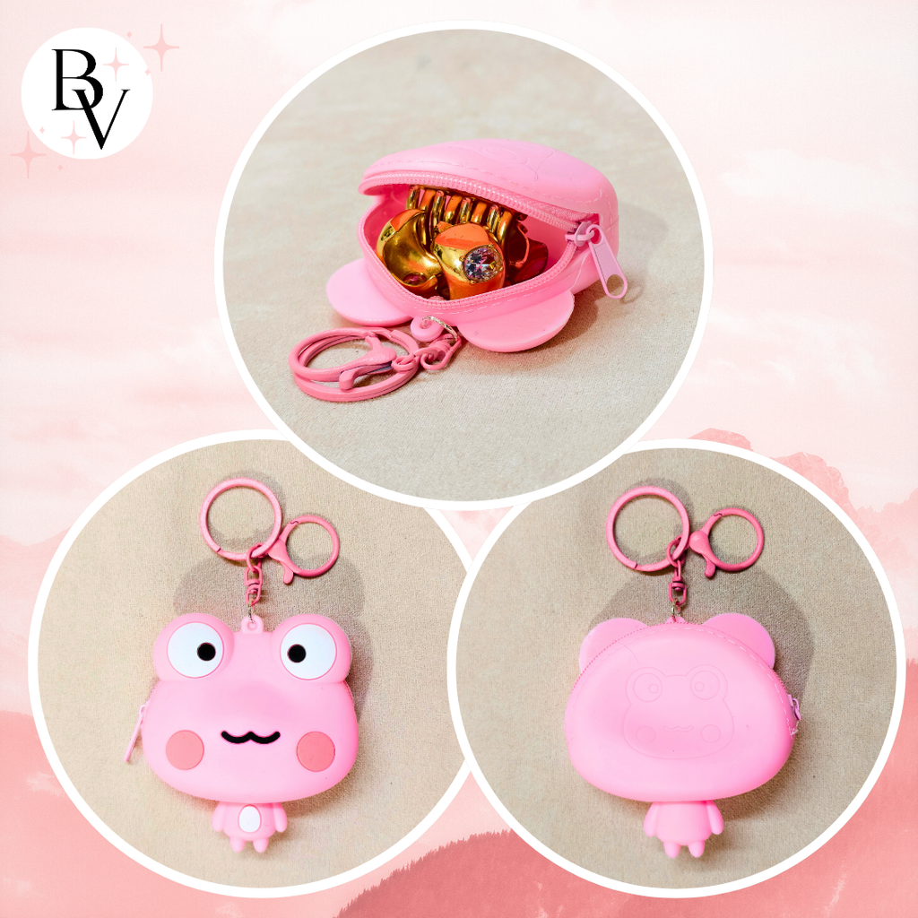 Pink keychain with a small pouch and keyring on a pink background