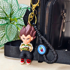 Vegeta Casual Keyring  Attached On Purse As Bag Charm On Beige Background.