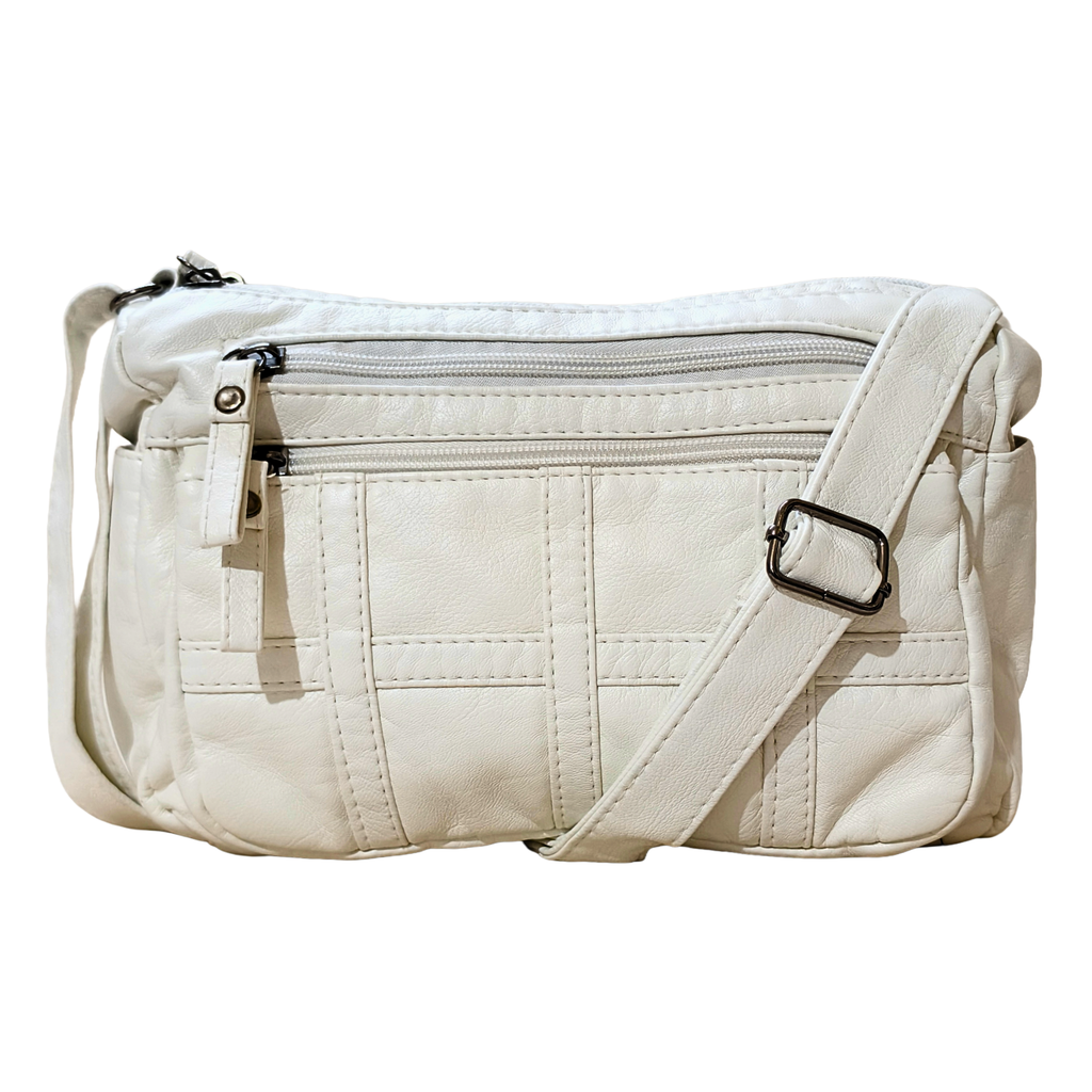 White crossbody bag with a strap on a white background