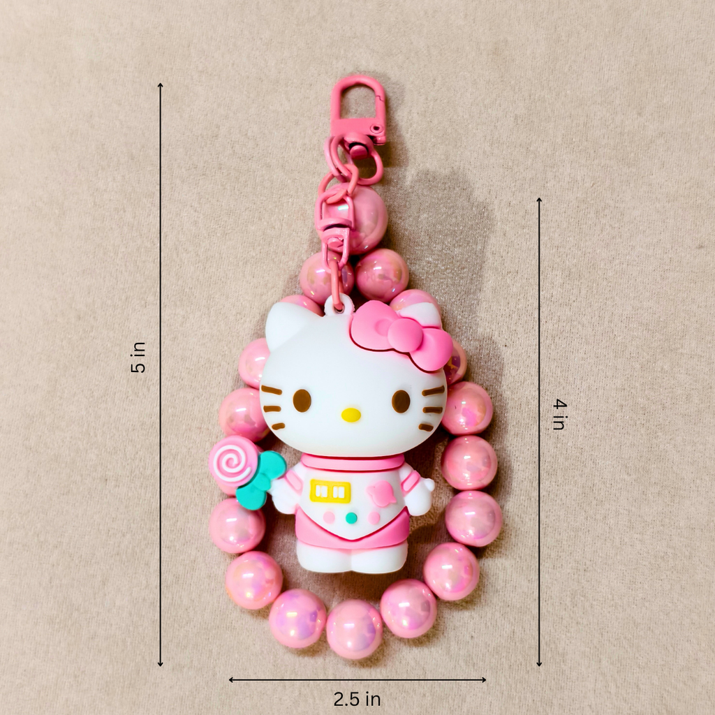 Hello Kitty keychain with pink beads on a beige background