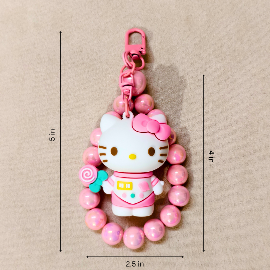 Hello Kitty keychain with pink beads on a beige background