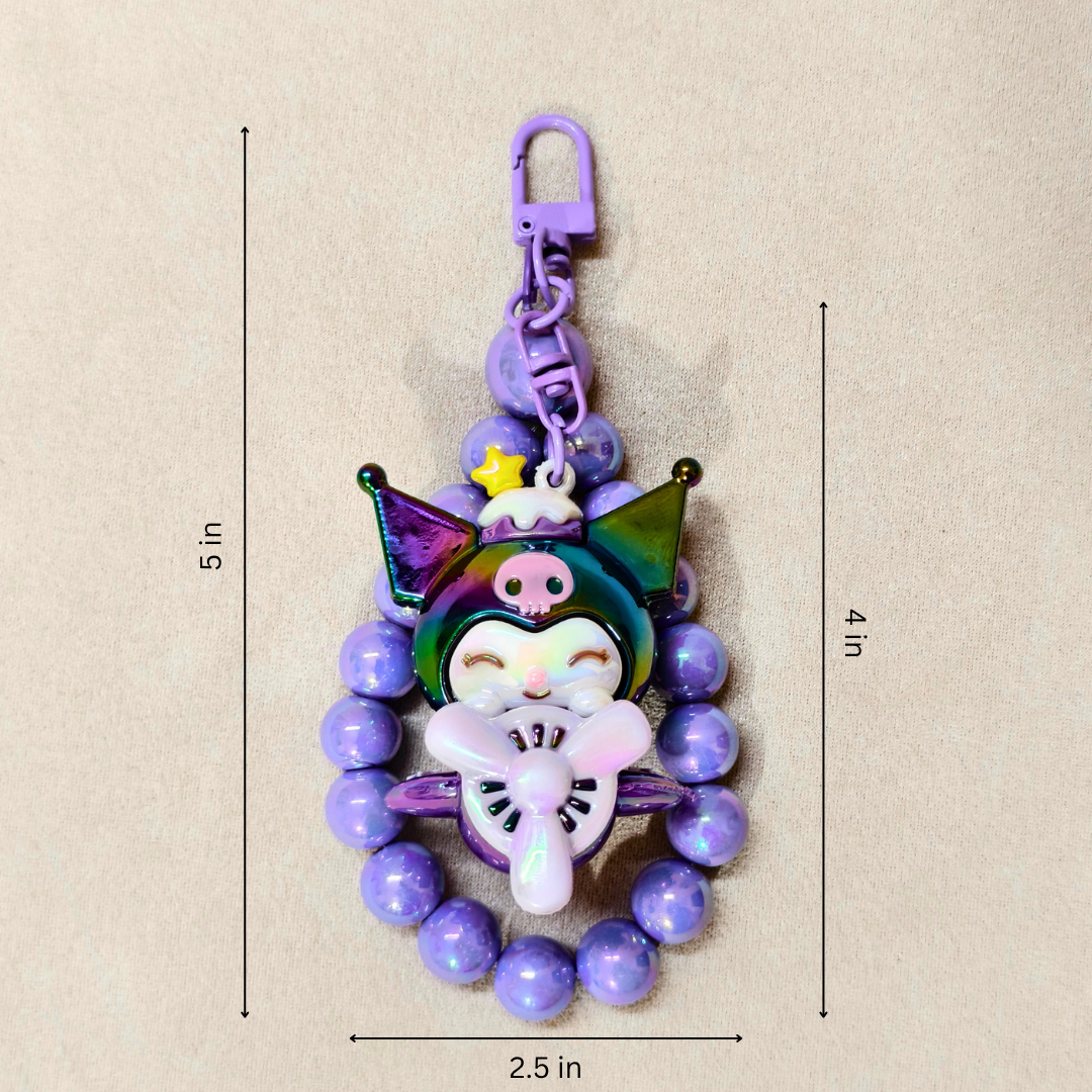 Colorful keychain with measurements on a beige background