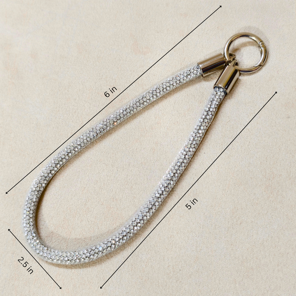 Measurement chart of a keychain with a rope-like strap on a beige background