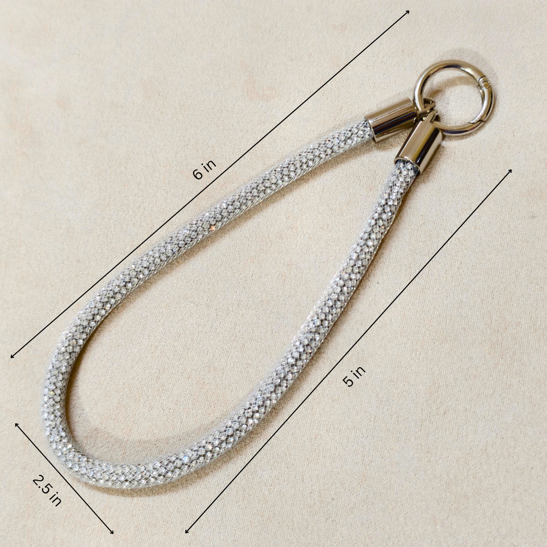 Measurement chart of a keychain with a rope-like strap on a beige background