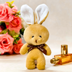 Plush toy rabbit with bunny ears and a 'Love' ribbon, surrounded by flowers and a perfume bottle.
