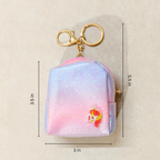 Small pouch with unicorn design and keychain on a beige background with measurements.