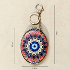 Oval Evil Eye Black Pocket Mirror  With Measurements On  Beige Background.