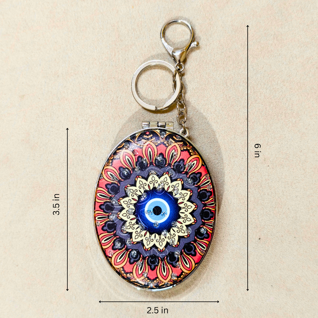 Oval Evil Eye Black Pocket Mirror  With Measurements On  Beige Background.