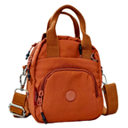 Orange handbag with multiple straps and a visible brand logo on a white background