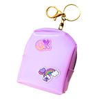 Pink keychain with cartoon designs on a white background