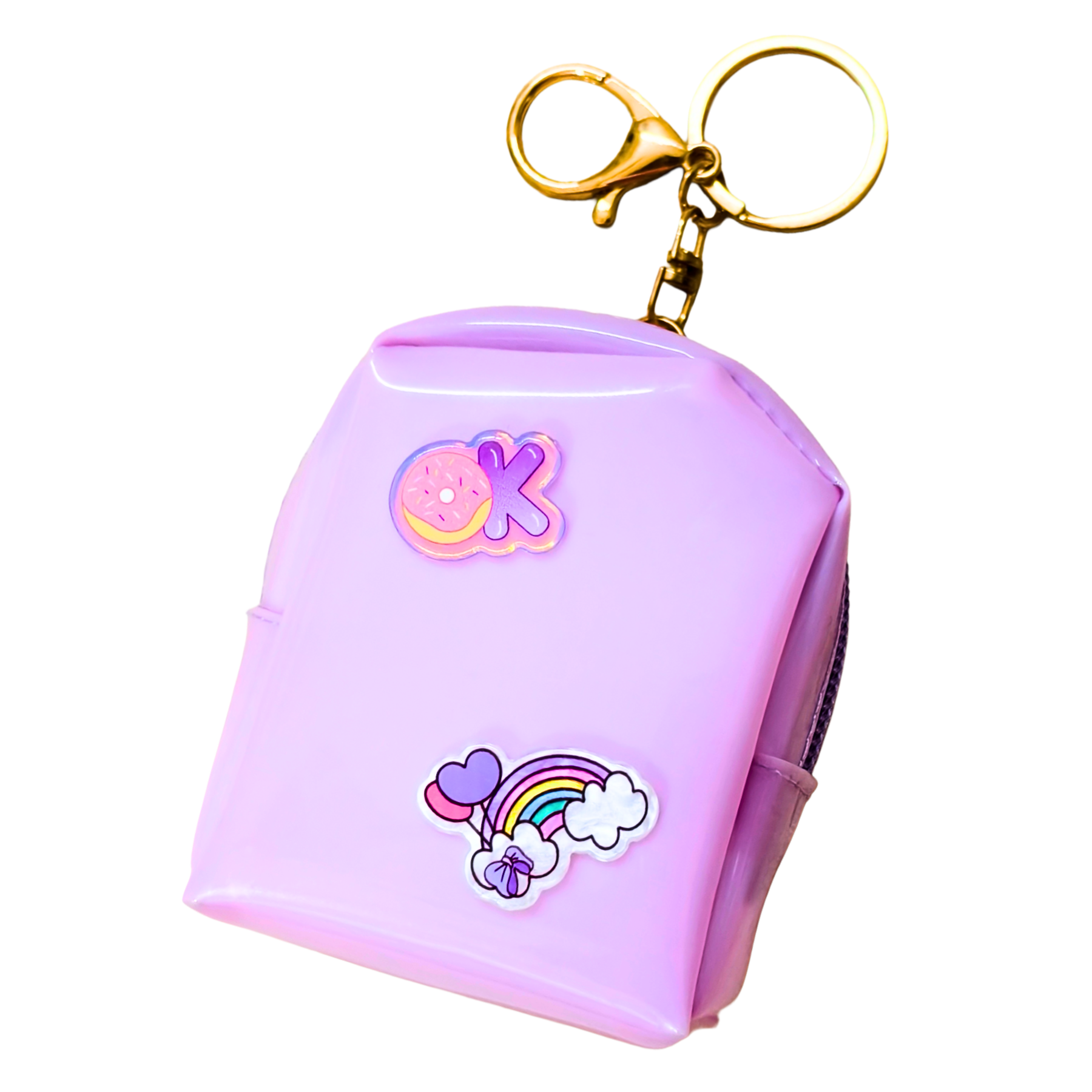 Pink keychain with cartoon designs on a white background