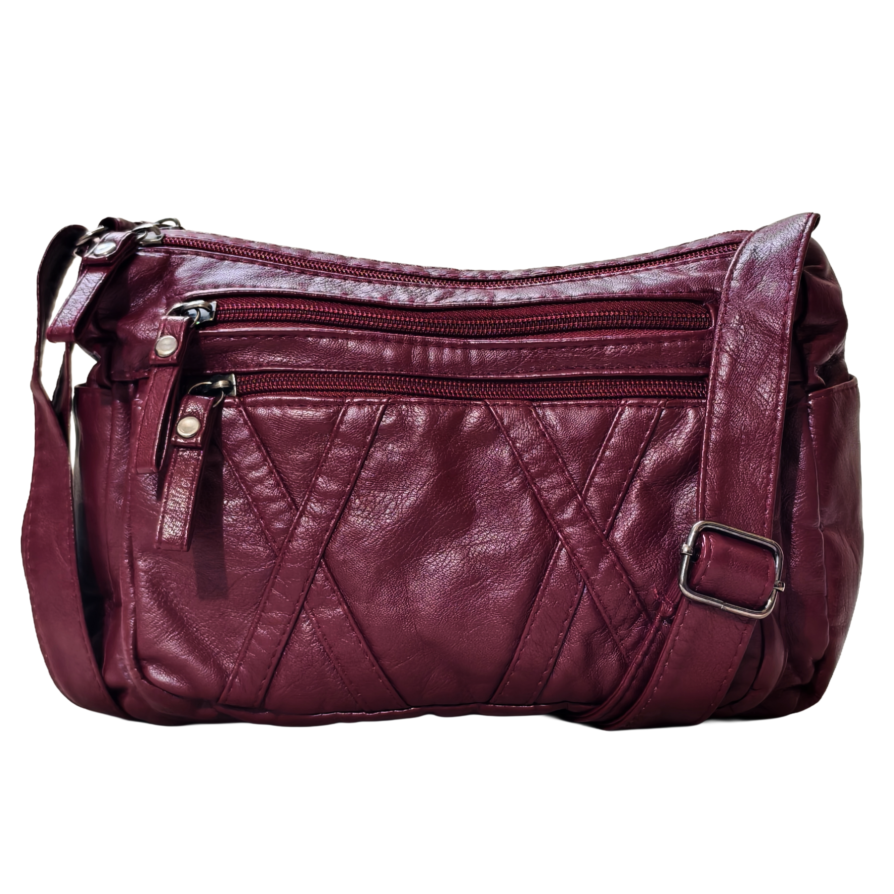 Maroon leather handbag with multiple zippers on a white background