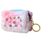 Fluffy pink and white keychain with rhinestones and a gold ring on a white background