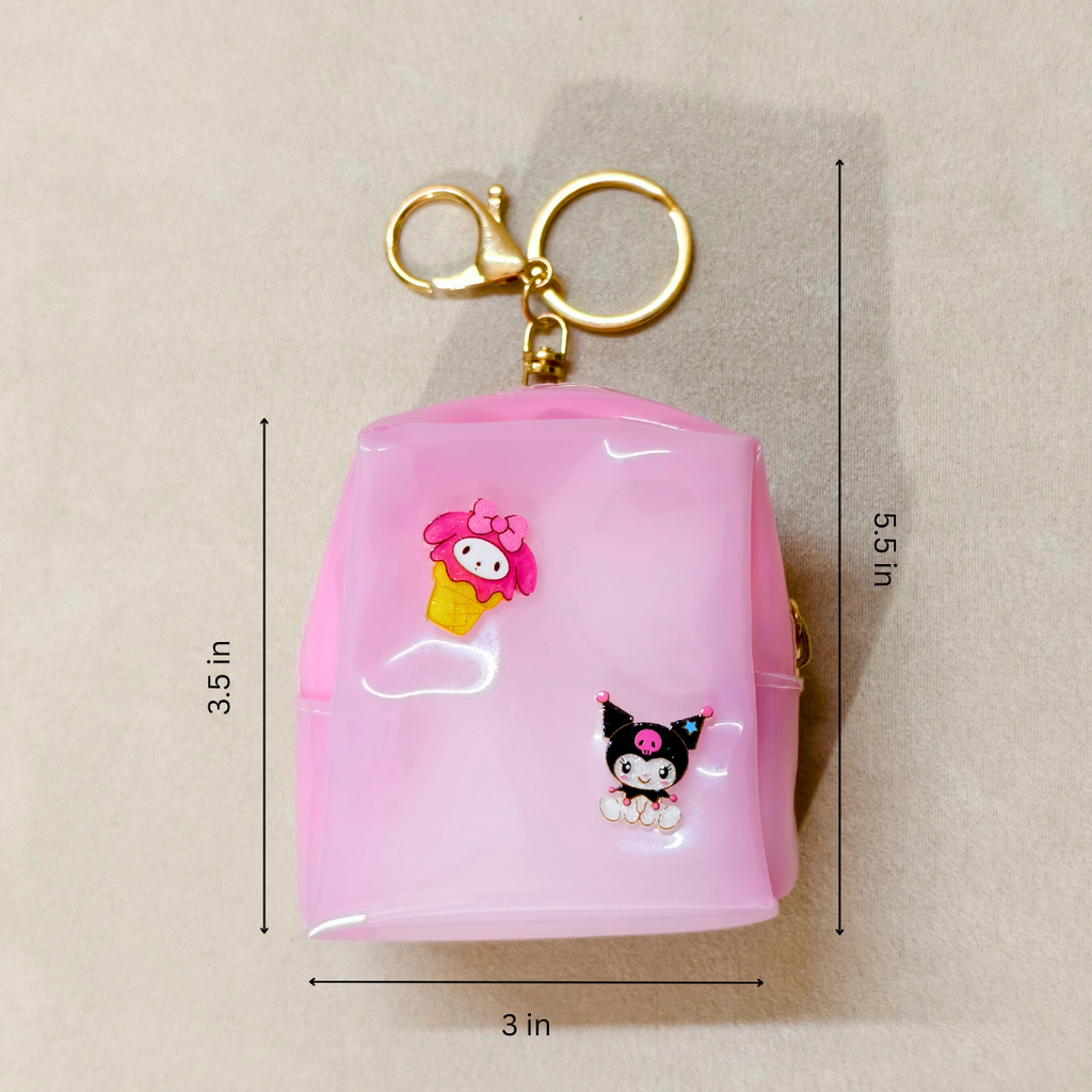 Pink keychain with cartoon characters and measurements on a beige background