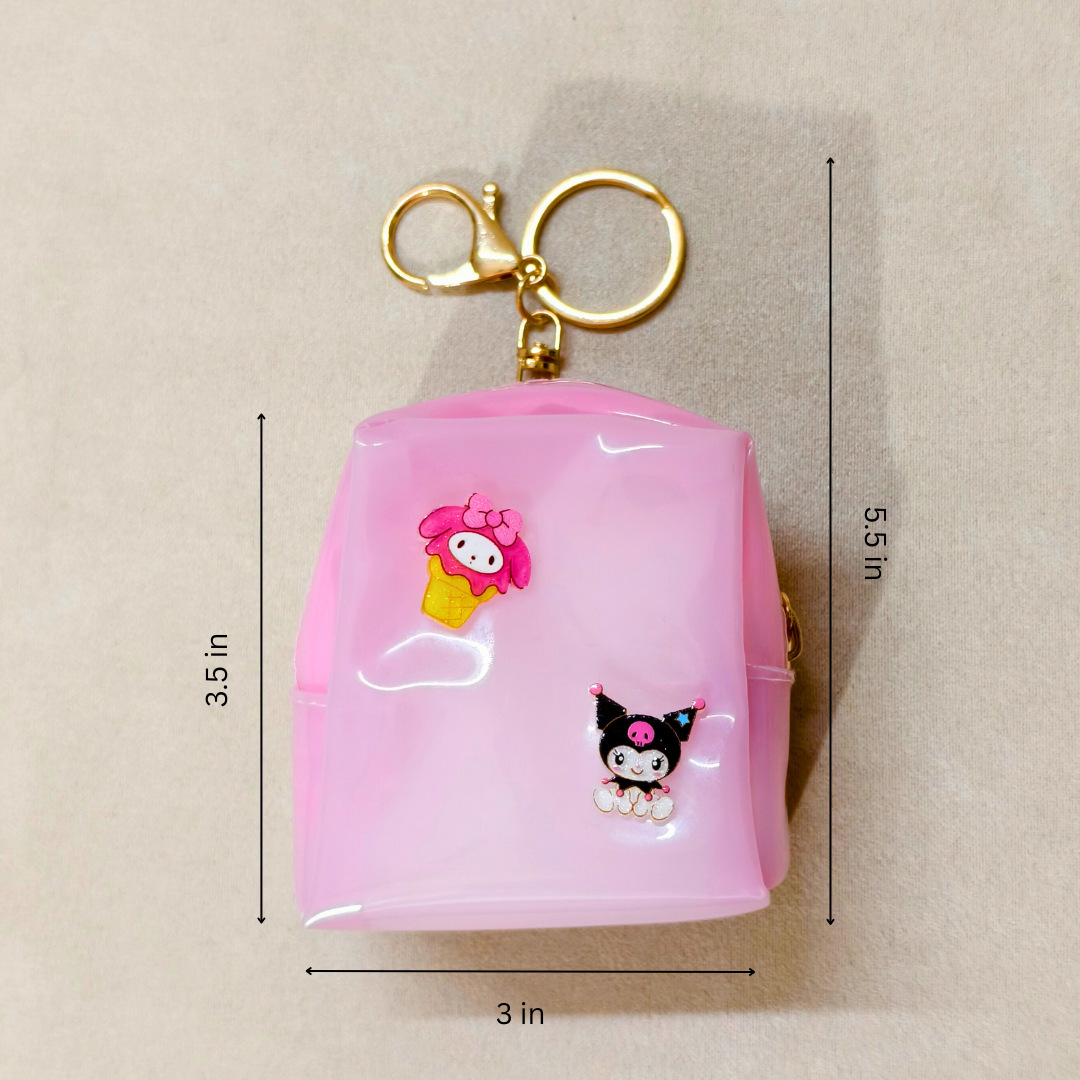 Pink keychain with cartoon characters and measurements on a beige background