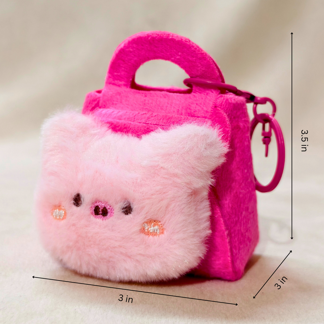Pink plush toy resembling a cat with a small handbag, on a beige background with measurements indicated.