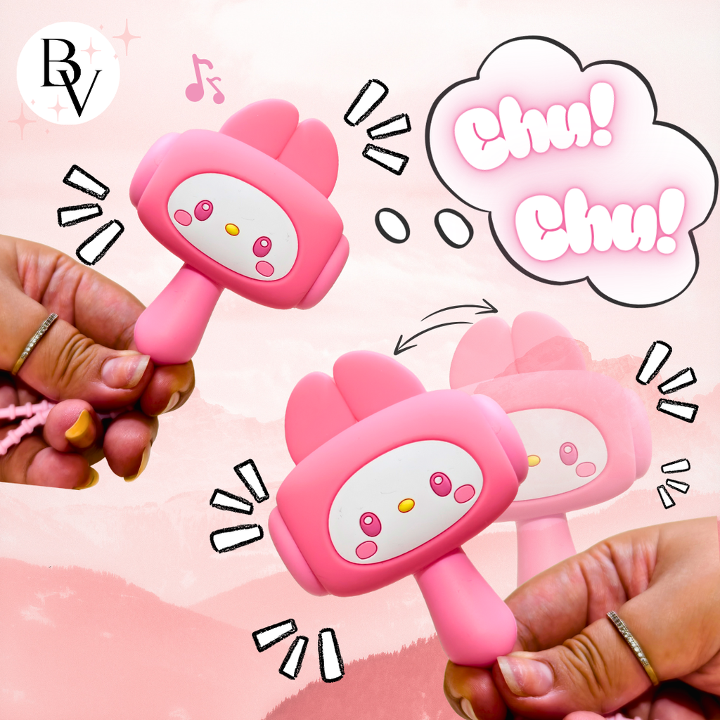 Two pink cartoon-style rattles held by hands with a pink background and 'Chu! Chu!' text.