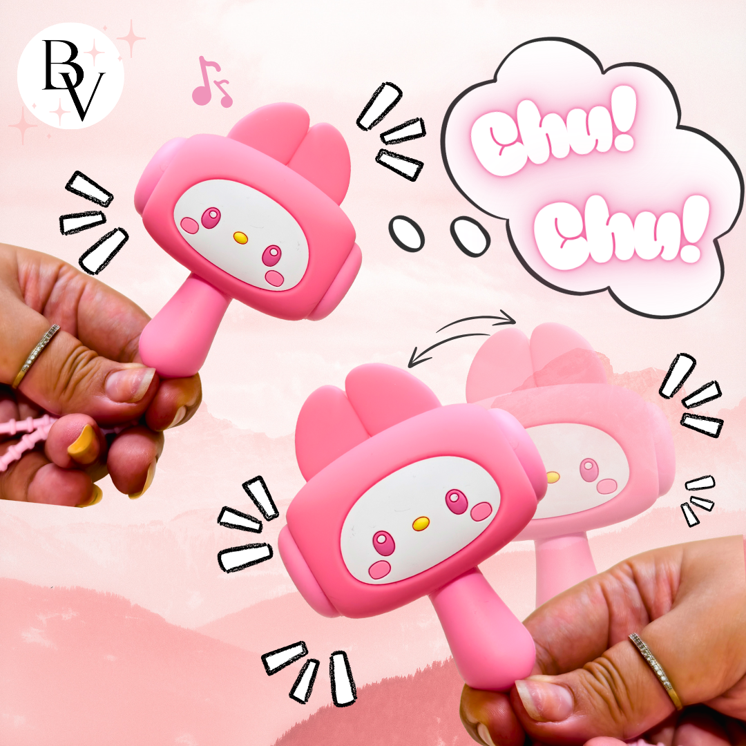 Two pink cartoon-style rattles held by hands with a pink background and 'Chu! Chu!' text.