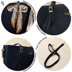Black handbag with adjustable bow scarf, pebbled leather, and extendable shoulder strap on a white background.