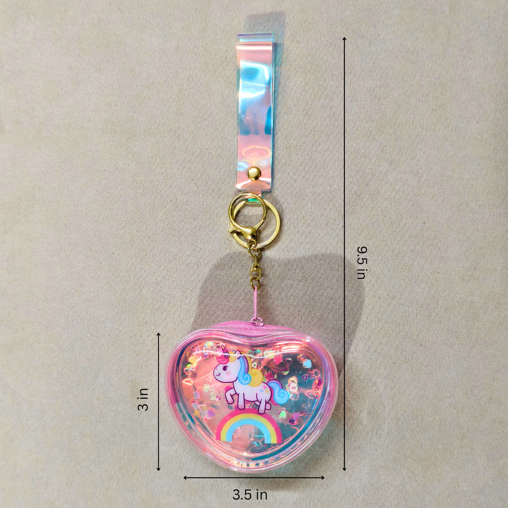 Heart-shaped keychain with unicorn design and measurements on a beige background