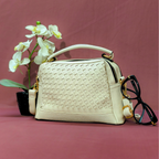 Beige handbag with woven pattern on a pink background