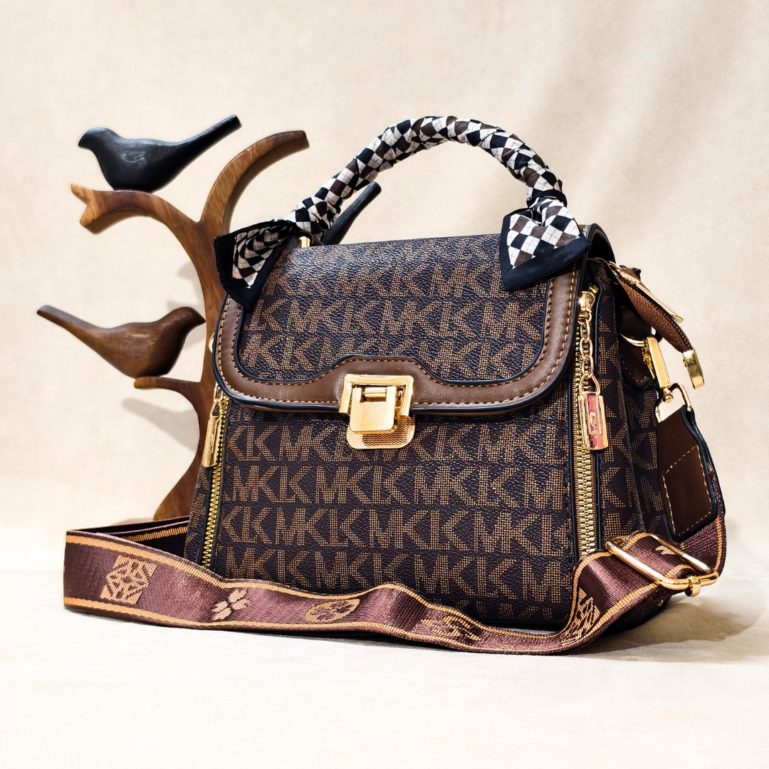 Designer handbag with brand logo on a neutral background