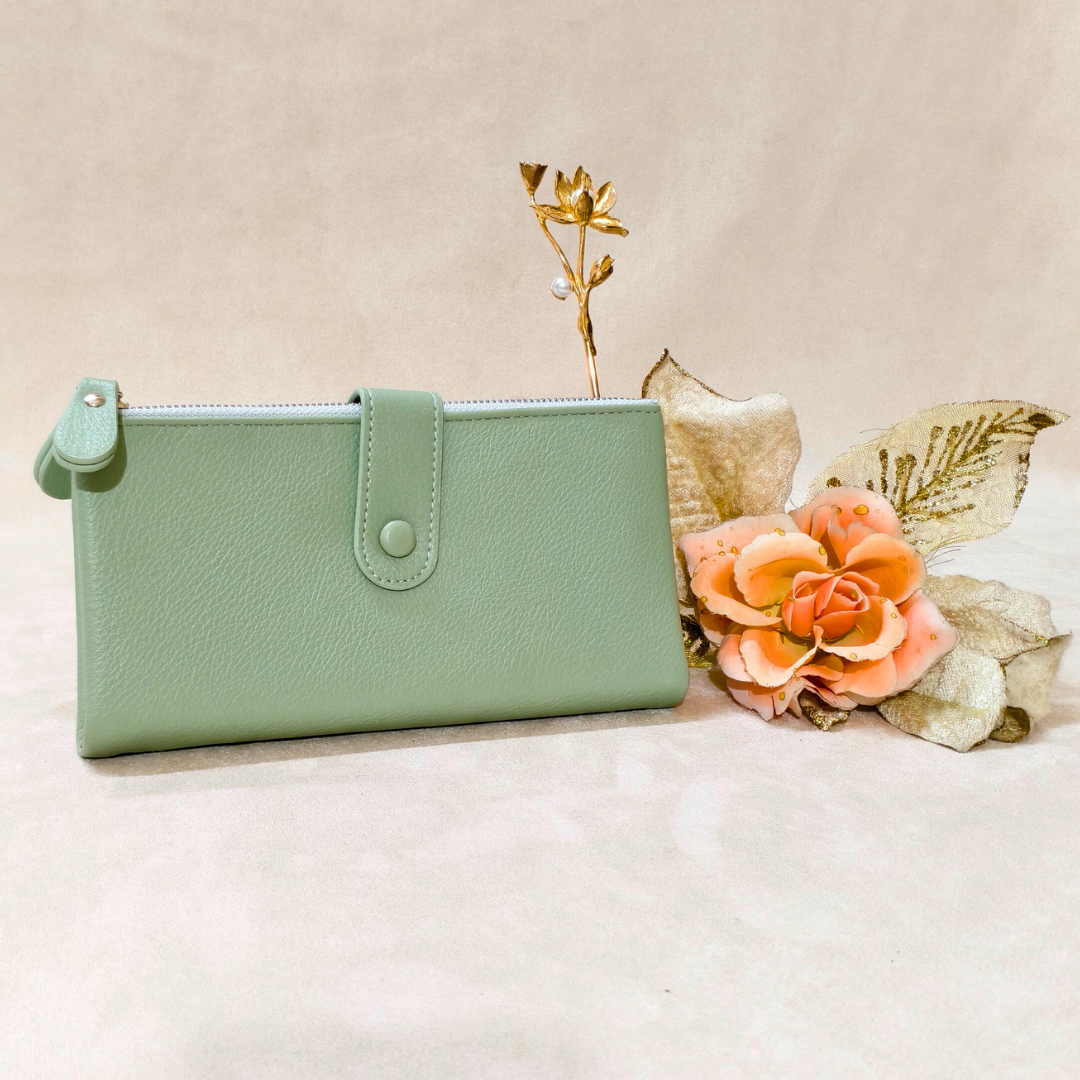 Mint green wallet with decorative flowers on a beige background