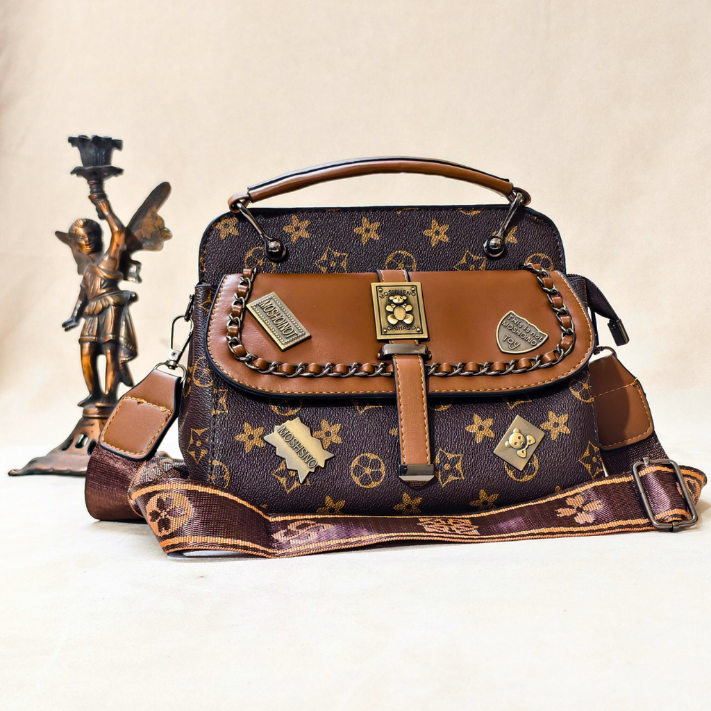 Designer handbag with star pattern and gold accents on a beige background