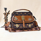 Designer handbag with star pattern and gold accents on a beige background