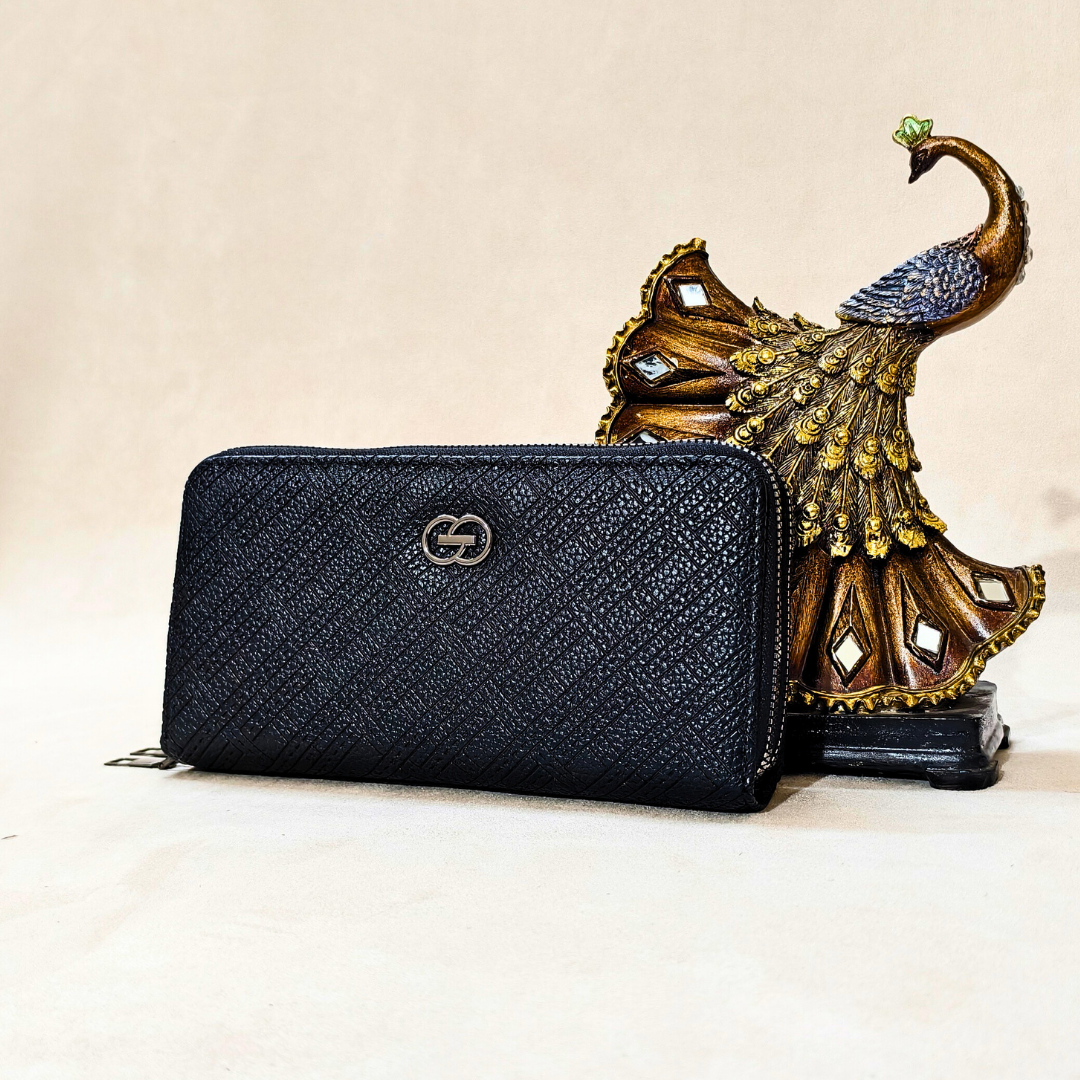 black wallet with a peacock on the right in front of a neutral background
