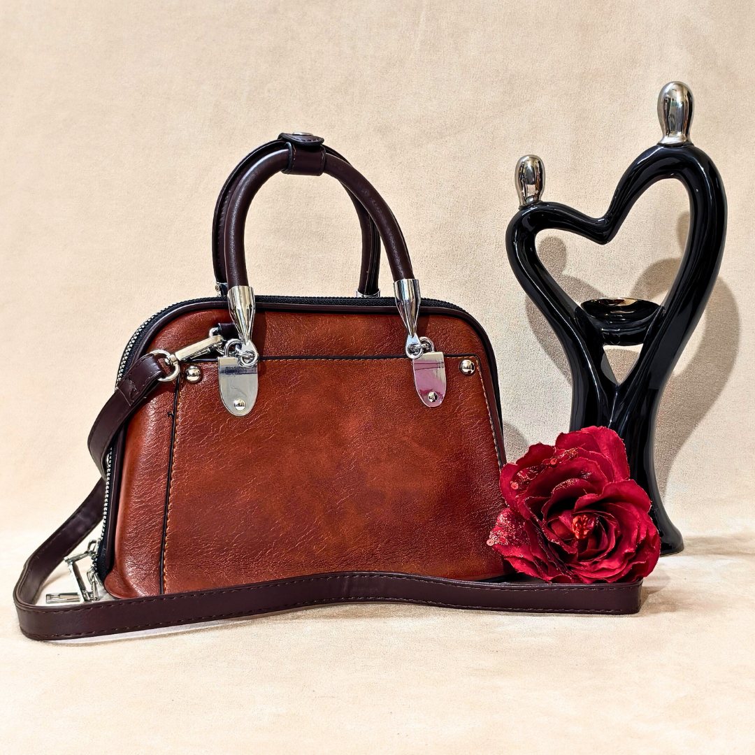 Brown handbag with a red rose on a beige background