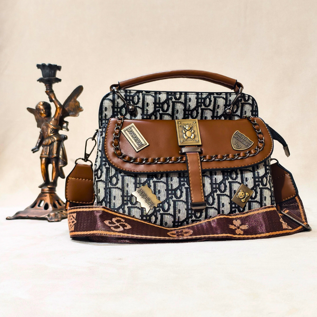Designer handbag with intricate pattern and brown accents on a neutral background