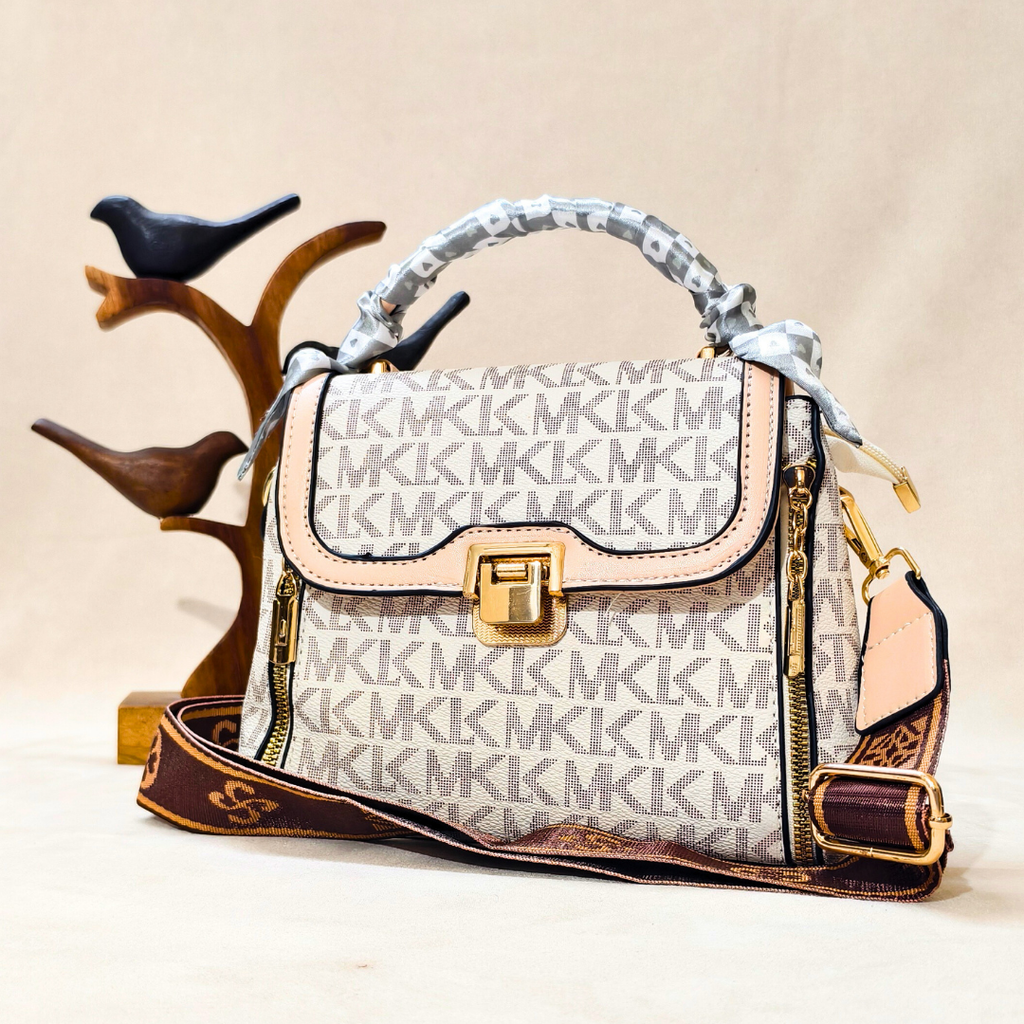 Designer handbag with visible brand logo on a neutral background