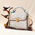 Designer handbag with visible brand logo on a neutral background
