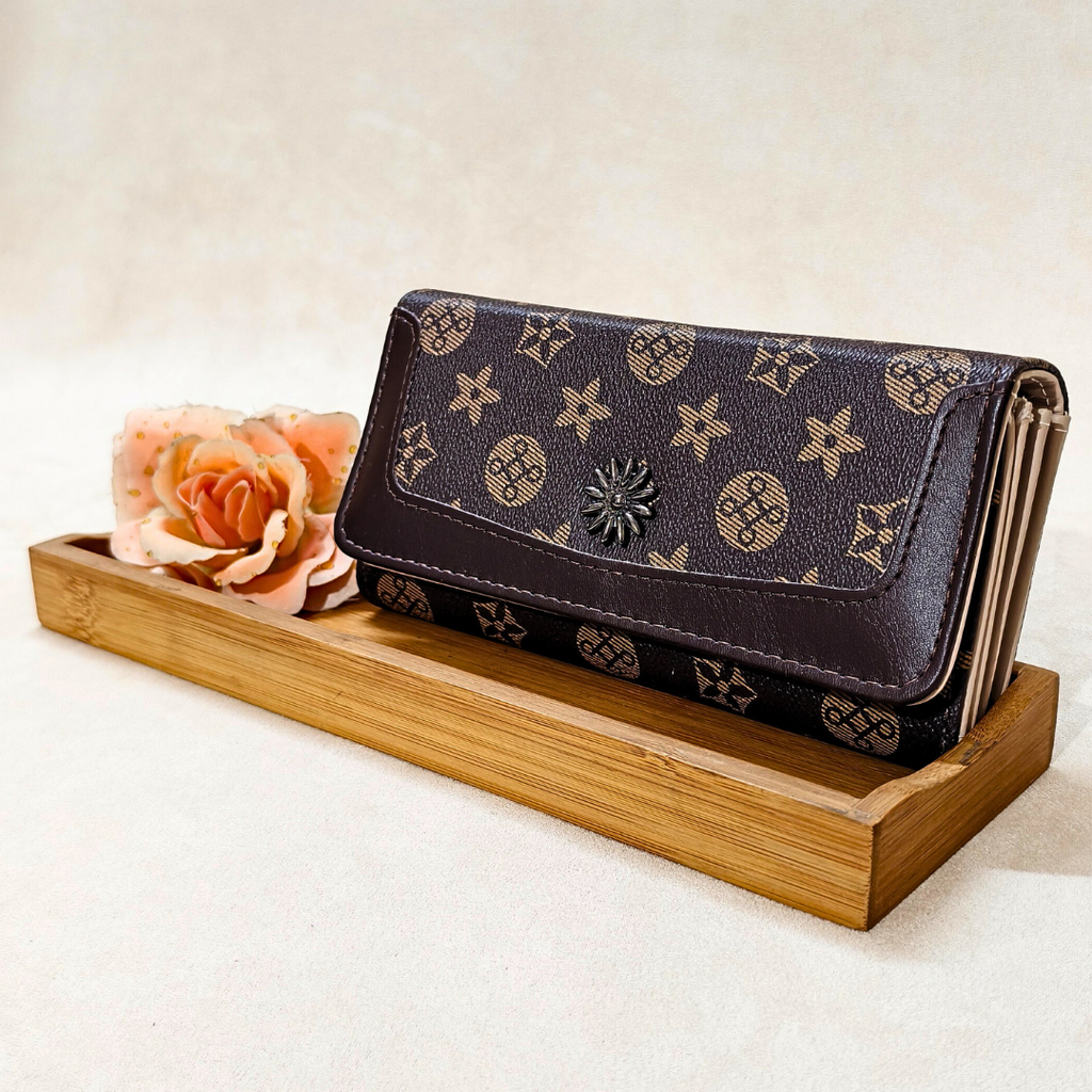 Designer wallet on a wooden stand with a flower