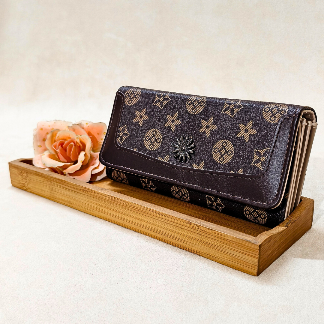 Designer wallet on a wooden stand with a flower