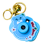A blue bear-shaped toy camera keychain with a gold clasp and bell, featuring cartoon details and the text 'My Bear'.
