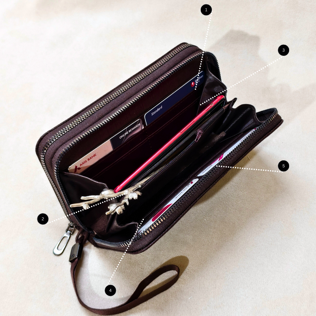 Open black wallet with compartments on a beige background