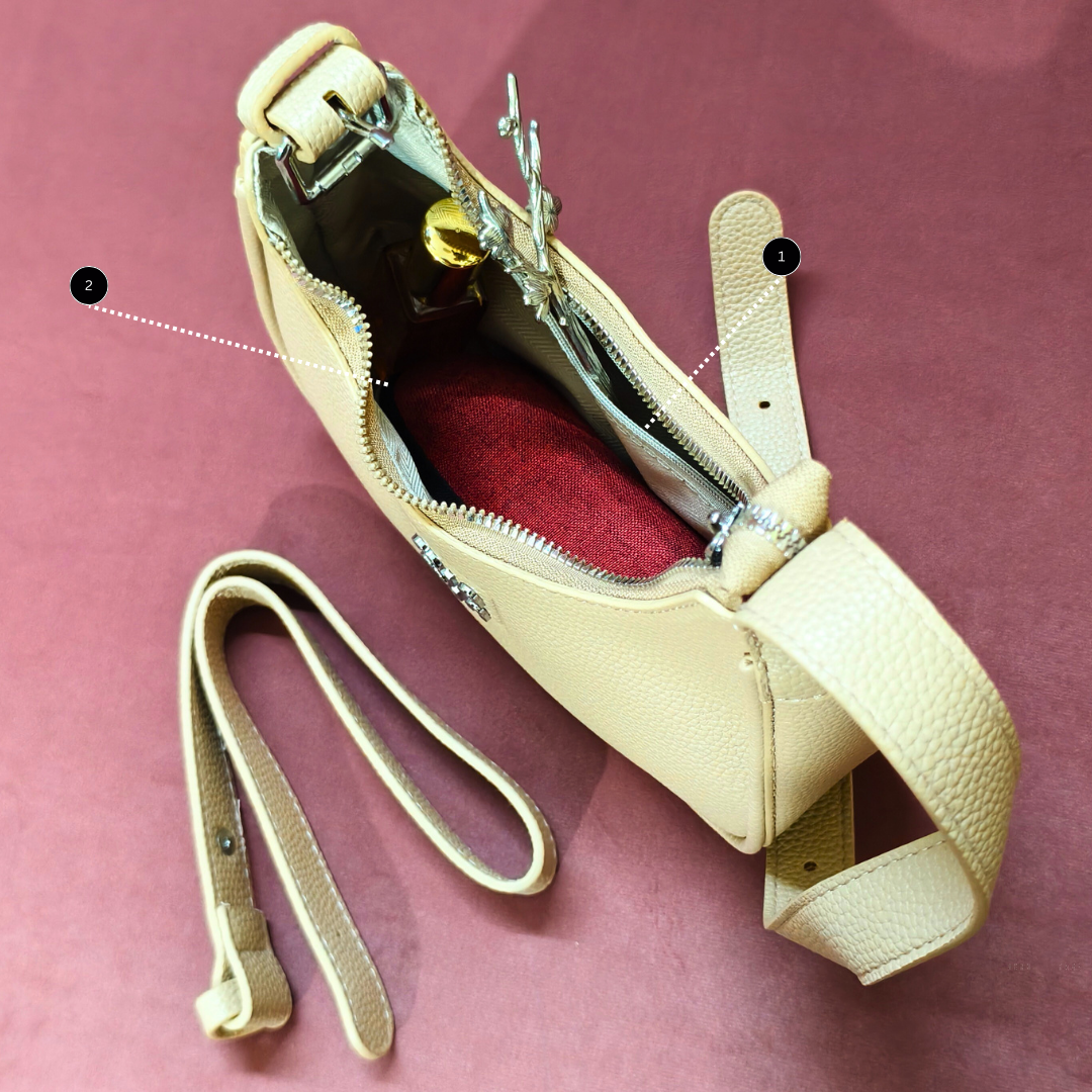 Beige handbag with a strap on a pink background
