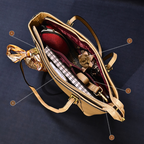 Gold handbag with a bow detail on a dark background