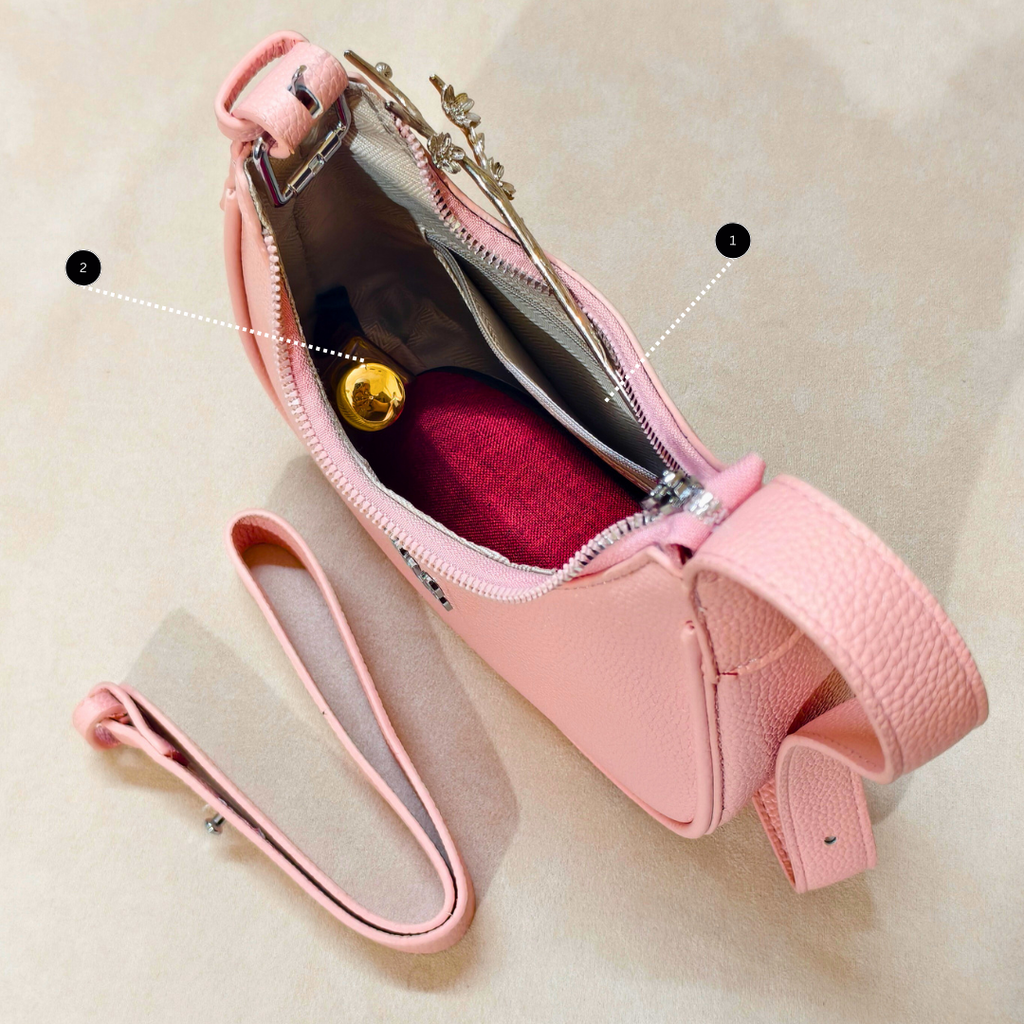 Pink handbag with a strap on a beige background