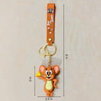 Cartoon character keychain with measurements on a beige background