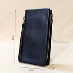 Navy blue leather clutch bag with gold zipper on a beige background, showing measurements.