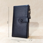 Black leather wallet with measurements on a beige background
