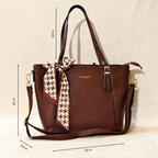 Brown handbag with a strap and measurements on a beige background