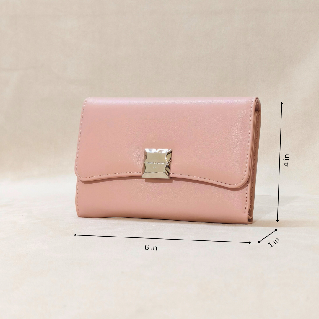 Pink wallet with gold clasp on a beige background, shown with measurements.