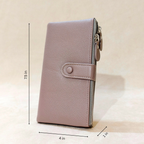 Pink wallet with measurements on a beige background