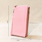 Pink zippered pouch with measurements on a beige background